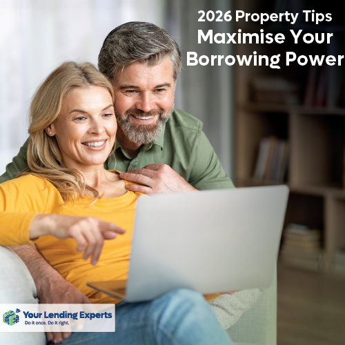 Smiling couple at a laptop in a bright kitchen; text says 2026 Property Tips, Maximise Your Borrowing Power.