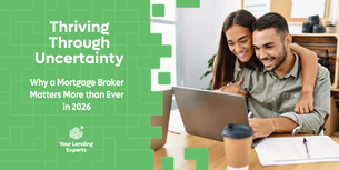 Smiling couple using a laptop in a cozy setting. Text reads "Stability starts with the right lending advice. Thrive in 2026."